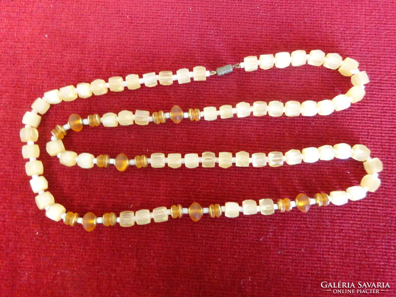 Cream-colored bijou necklace, length 72 cm. Jokai