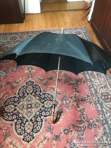 Old men's umbrella with a wooden handle. Damaged, in need of surface cleaning. For sale in good condition.