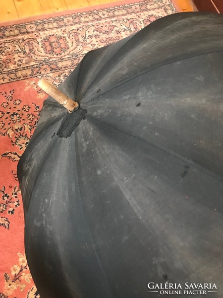 Old men's umbrella with a wooden handle. Damaged, in need of surface cleaning. For sale in good condition.