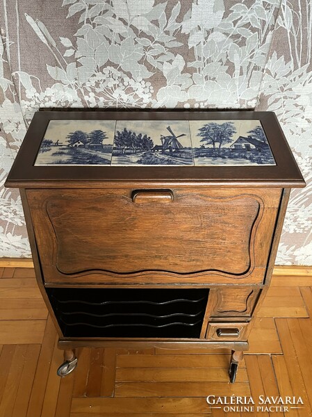 Small, rolling secretary with tile decoration