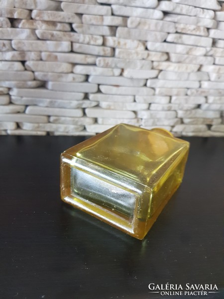 Old drinking glass 11 cm high, with a yellow layer