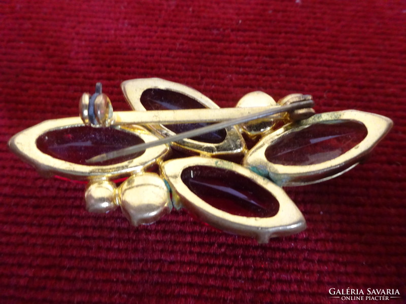 Gold frame brooch with red, yellow purple stone and white round stones. Imitation jewelry. Jokai.