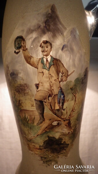 Old glass jug with glasses with a painting of a hunting trophy