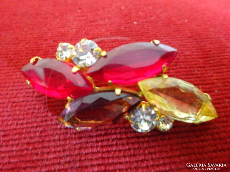 Gold frame brooch with red, yellow purple stone and white round stones. Imitation jewelry. Jokai.
