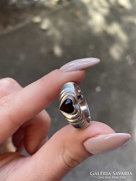 Silver ring with a red heart-shaped stone