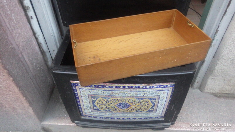 Older, openable wooden chest with painted faience inlay on the front, storage