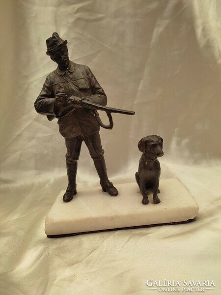 Hunter with his dog. Bronzed spiater statue.