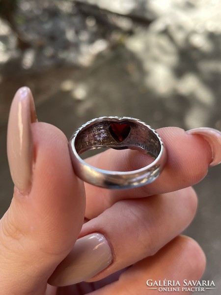 Silver ring with a red heart-shaped stone