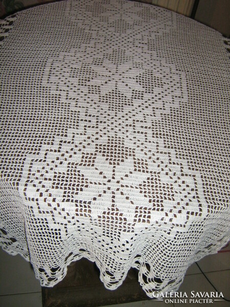 Beautiful snow-white handmade crochet lace tablecloth