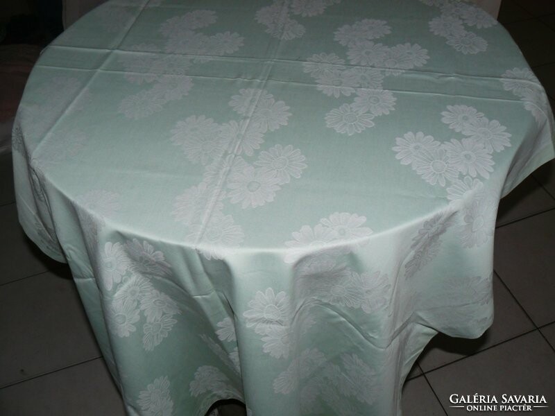 Beautiful pale green damask tablecloth with white flowers