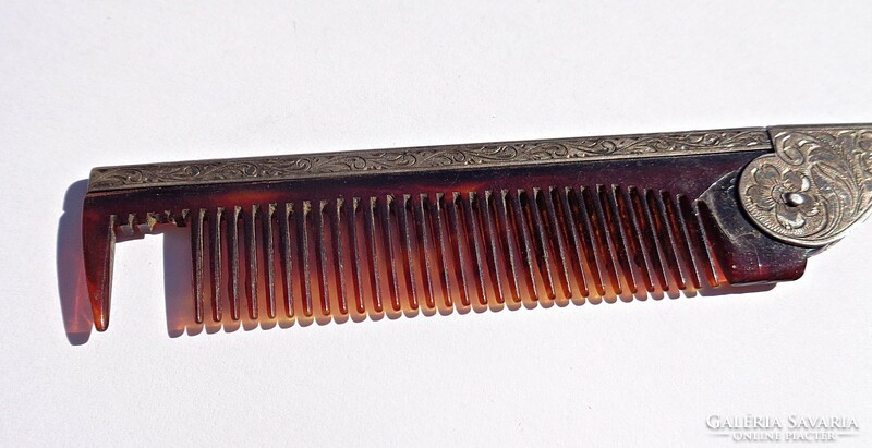 Old folding comb with silver case