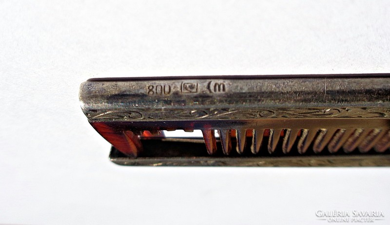 Old folding comb with silver case
