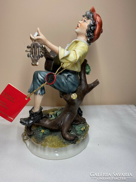 Capodimonte Italian porcelain playing boy with guitar 25cm