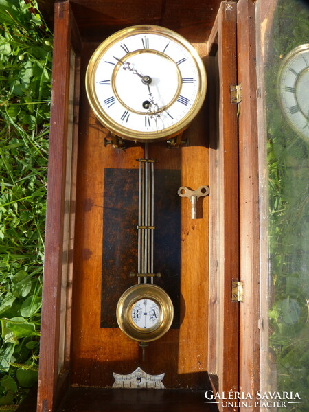 Tin German wall clock.