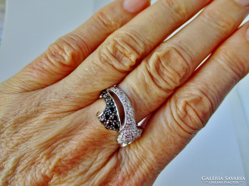 Elegant silver ring with black and white zirconia stones