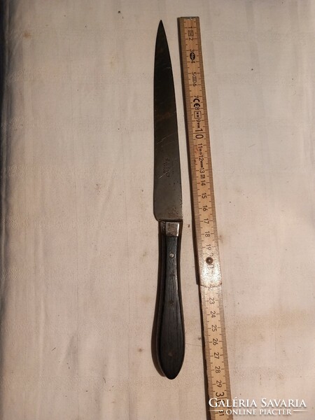 Old pastry knife with marked ebony handle