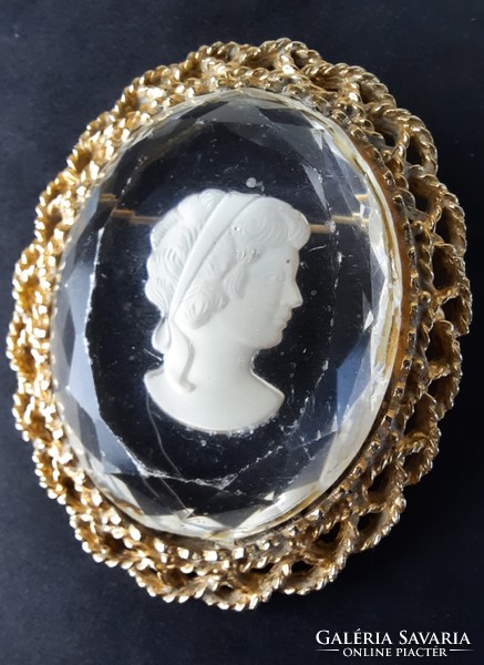 Vintage female head plastic badge, brooch, in a metal frame, jewels