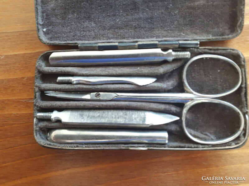 Antique uti manicure set in a silver-plated case