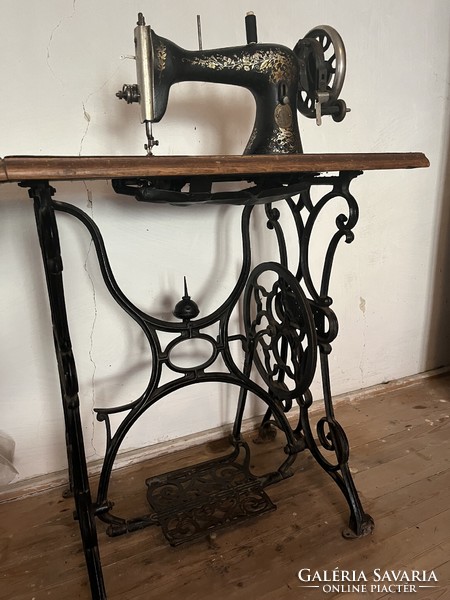 Antique cast iron bobbin sewing machine and stand