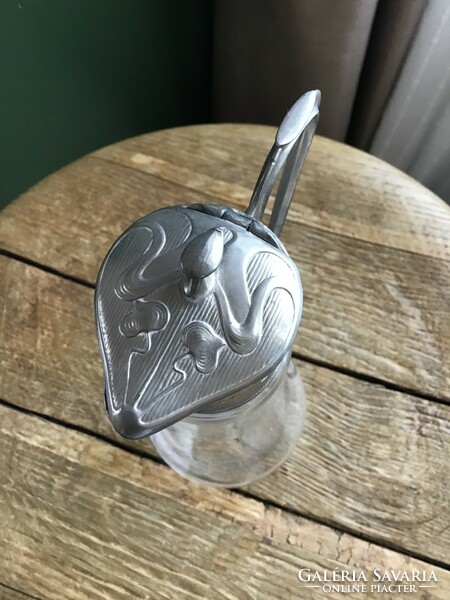 Art Nouveau-style oil or vinegar glass pourer with metal decoration