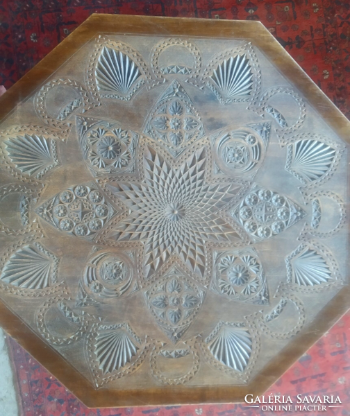 Table with master carving.