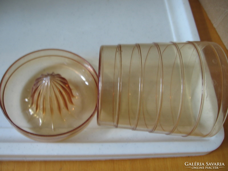 Retro honey-colored plastic cup with a squeeze of lemon