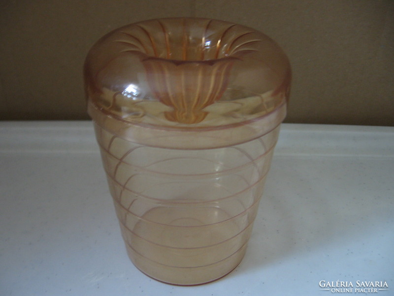 Retro honey-colored plastic cup with a squeeze of lemon
