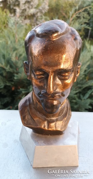 Bronze head with the inscription 