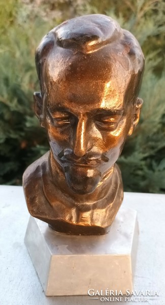 Bronze head with the inscription 