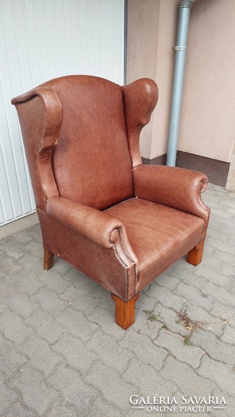 Large leather armchair with ears