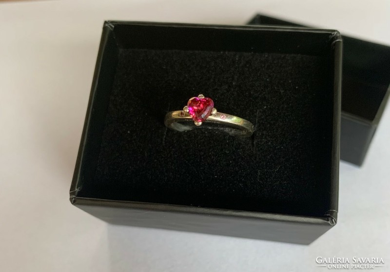 Silver ring with a red heart-shaped stone