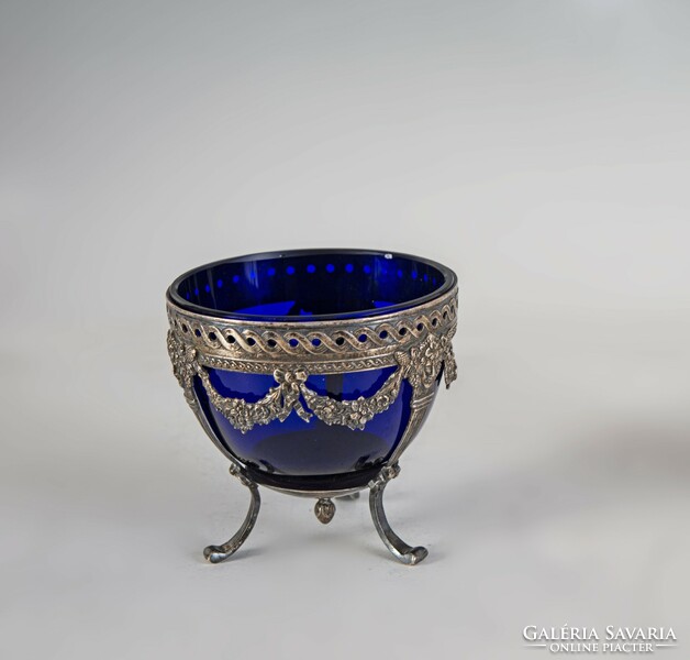 Silver blue glass tray decorated with stylized heads