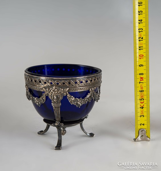 Silver blue glass tray decorated with stylized heads