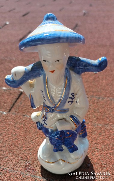 Oriental fisherman porcelain statue