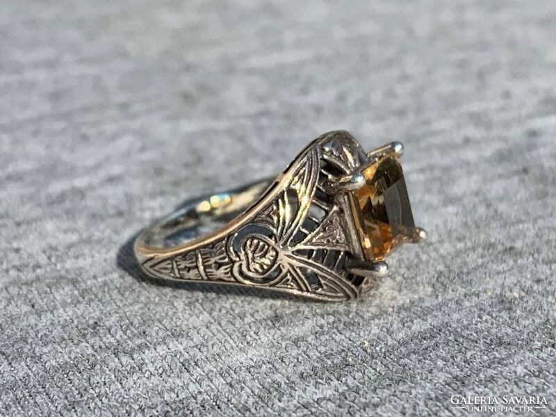 Women's silver ring with openwork pattern with yellow stones