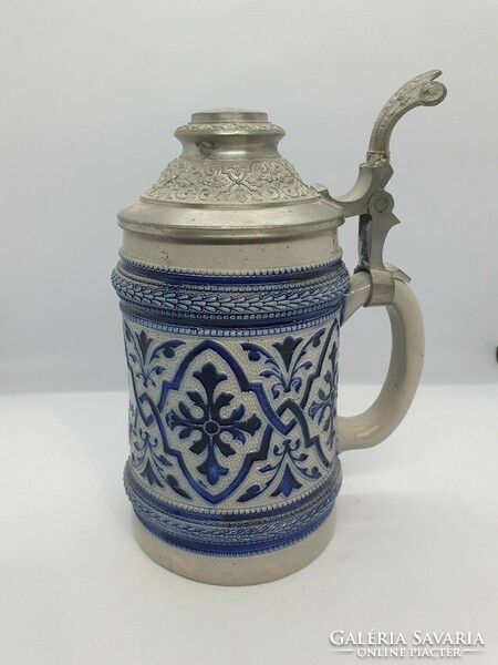 Old salt-glazed beer mug with tin lid