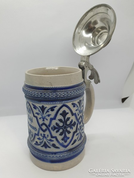 Old salt-glazed beer mug with tin lid