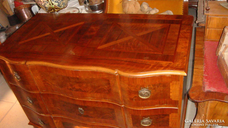 Baroque chest of drawers is large.