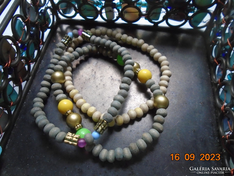 2 gray and 1 light beige bracelet decorated with colorful and gold tone pearls