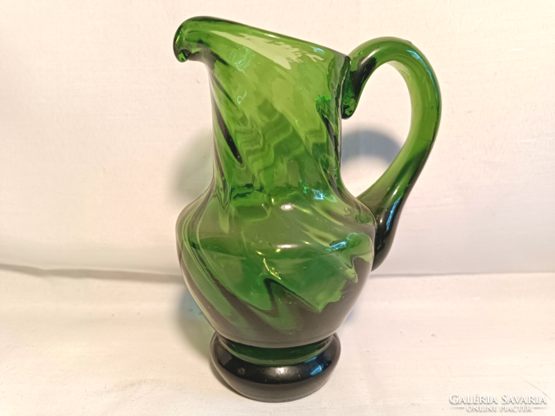 Green glass jug with glasses