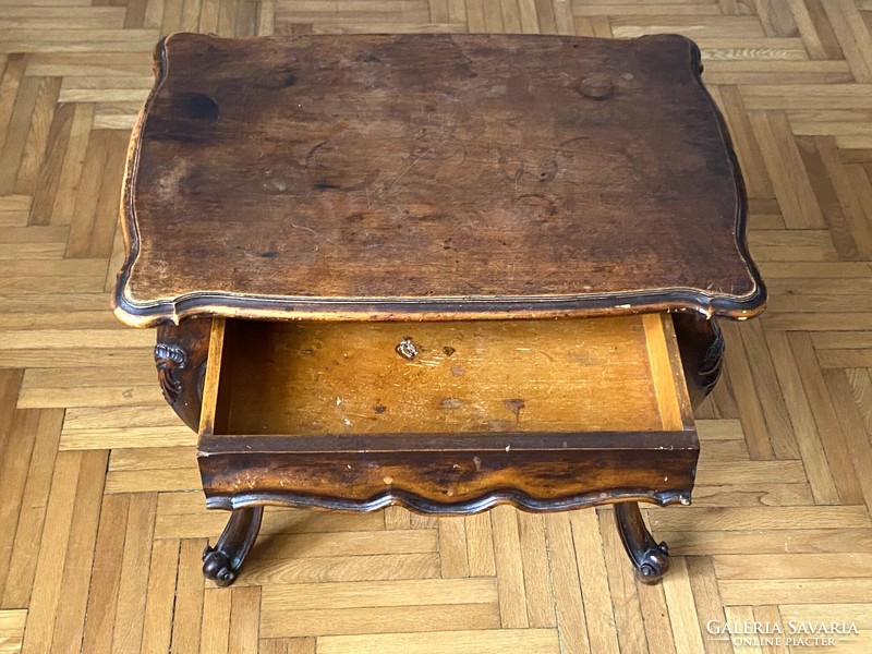 Baroque table with carved drawers