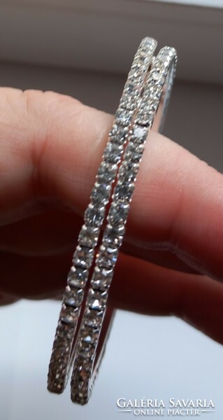 Silver-plated rhinestone hoop earrings.