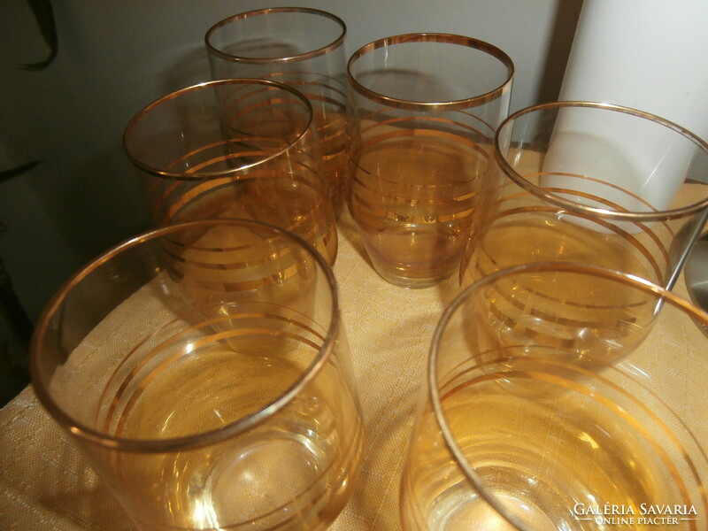 Retro gold striped glasses on a metal tray