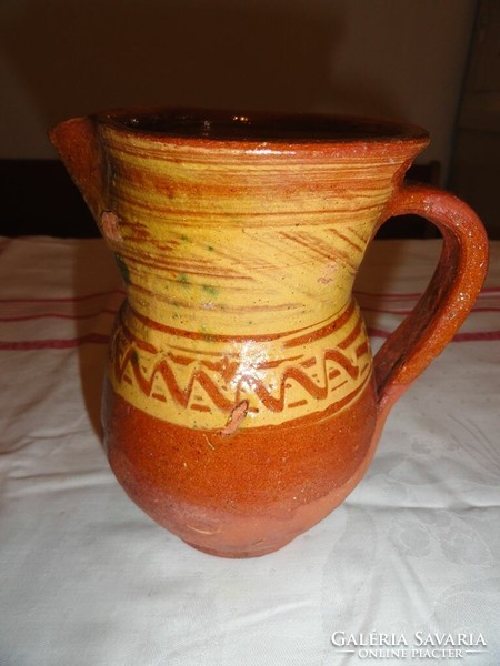 Brown folk earthenware jugs