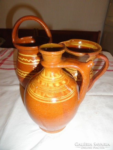 Brown folk earthenware jugs