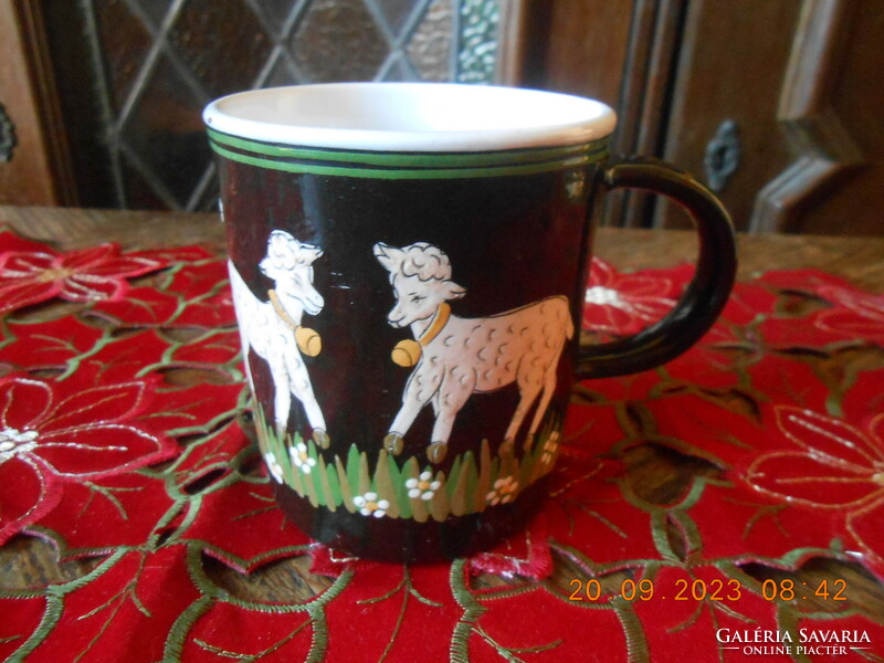 Handmade ceramic mug with hand-painted lamb motifs