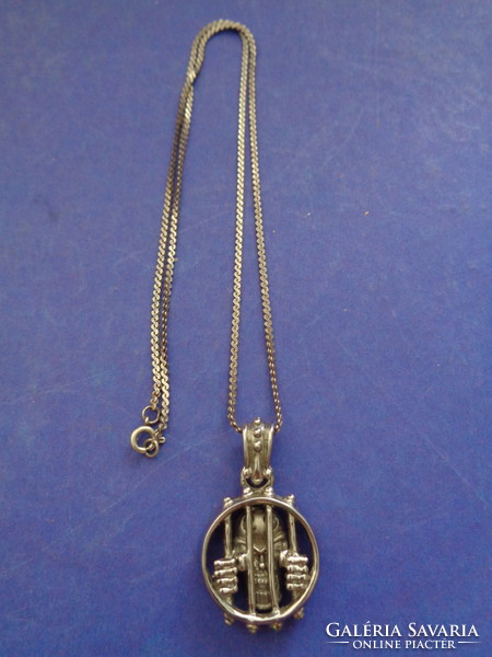 Steel extreme pendant on a silver chain