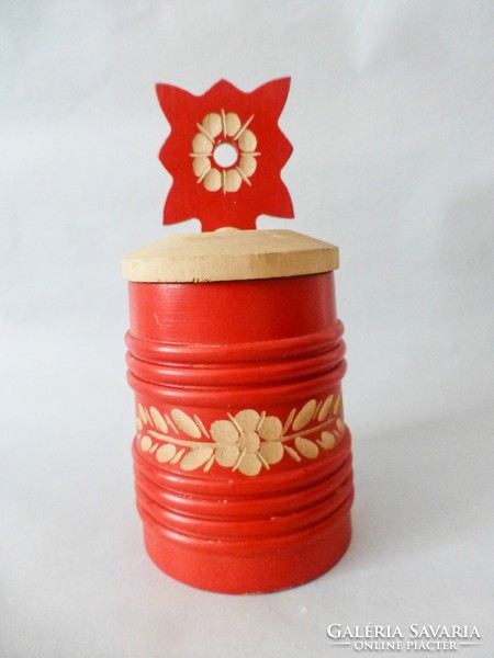 Carved wooden salt shaker with a red Hungarian pattern