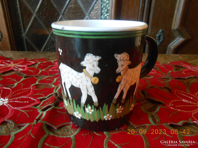 Handmade ceramic mug with hand-painted lamb motifs