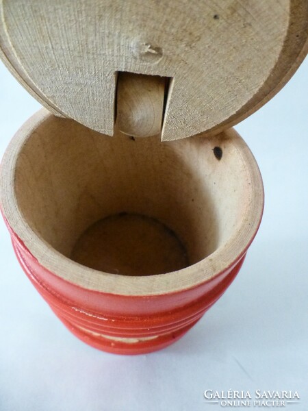 Carved wooden salt shaker with a red Hungarian pattern